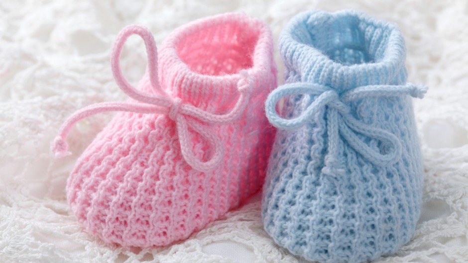 File: Blue and pink baby booties. GettyImages/egal