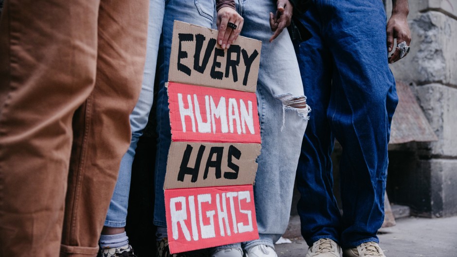 File: Group of people marching for human rights. GettyImages/Leo Patrizi