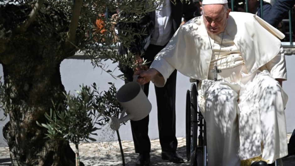 Before leaving the pope watered an olive tree, the symbol of peace, in the patio of the foundation