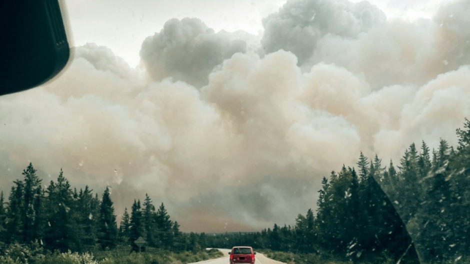 Wildfire smoke engulfing a forest in the northern zone of Canada's Quebec Province in mid July