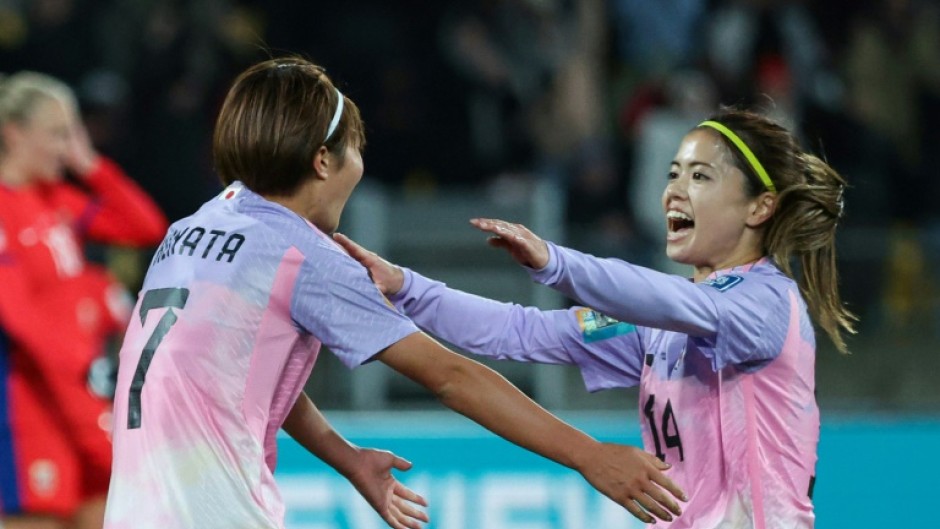 Hinata Miyazawa (L) celebrates scoring Japan's third goal against Norway with Yui Hasegawa (R) at the Women's World Cup