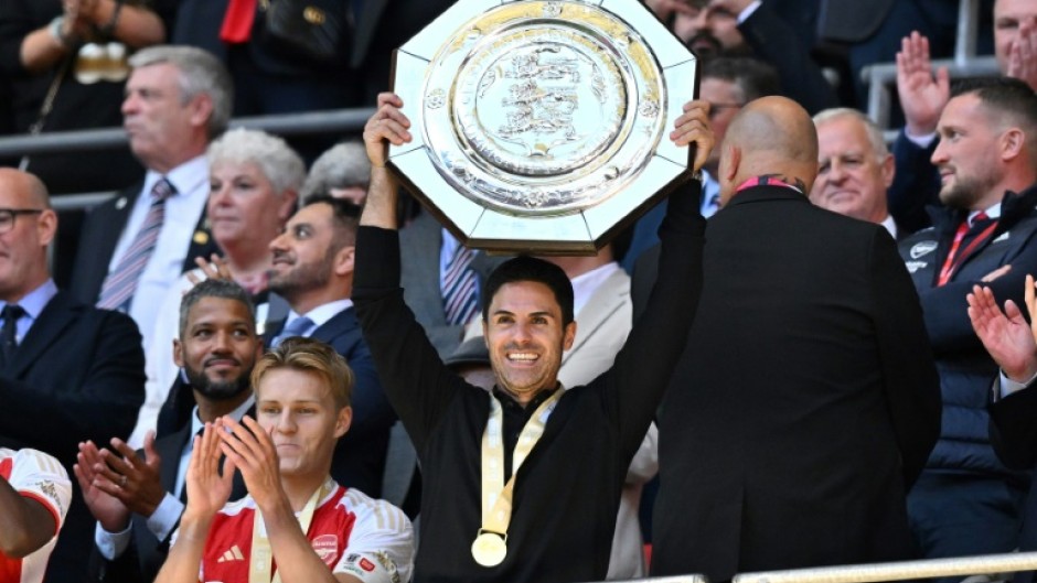 Arsenal manager Mikel Arteta lifts the Community Shield trophy