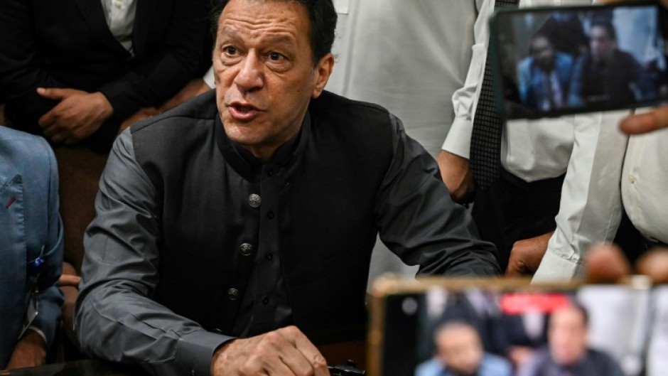 The sentence disqualifies Imran Khan (pictured during a court appearance in July) from taking part in upcoming elections