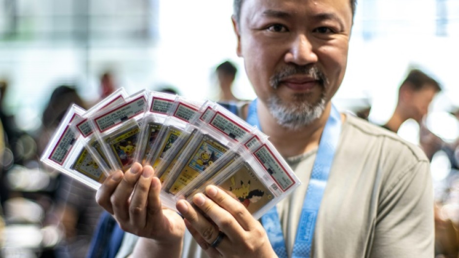 Pokemon fan Jeffrey Ng shows off some of his collection in the dedicated trade area at the 2023 Pokemon World Championships