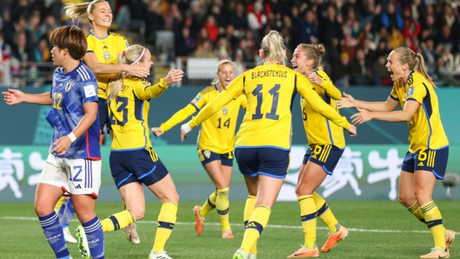 Sweden players celebrate after Amanda Ilestedt put them in front against Japan