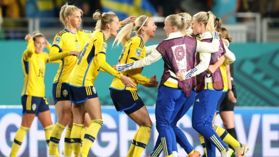 Sweden players celebrate after beating Japan at Eden Park to set up a semi-final against Spain