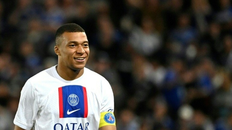 Kylian Mbappe looks on from the stands in Paris Saint-Germain's season opener after being left out over a contract dispute