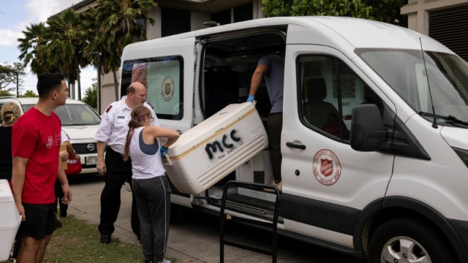 Members of the Salvation Army and other volunteer networks pick up the food, which arrives at shelters and in Lahaina still warm