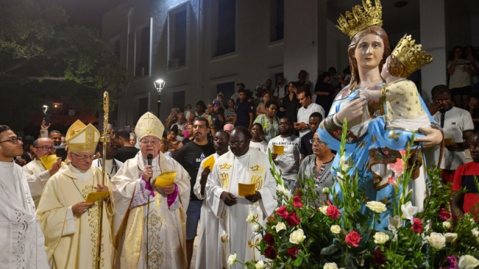 Each year the Virgin Mary figurine has been carried slightly farther from Tunisia's oldest church during the Feast of the Assumption procession