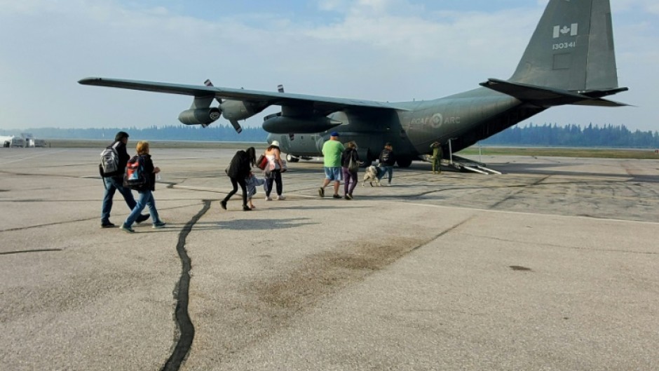 The Royal Canadian Airforce has joined in the emergence response by airlifting out residents fleeing fires in the Northwest Territories