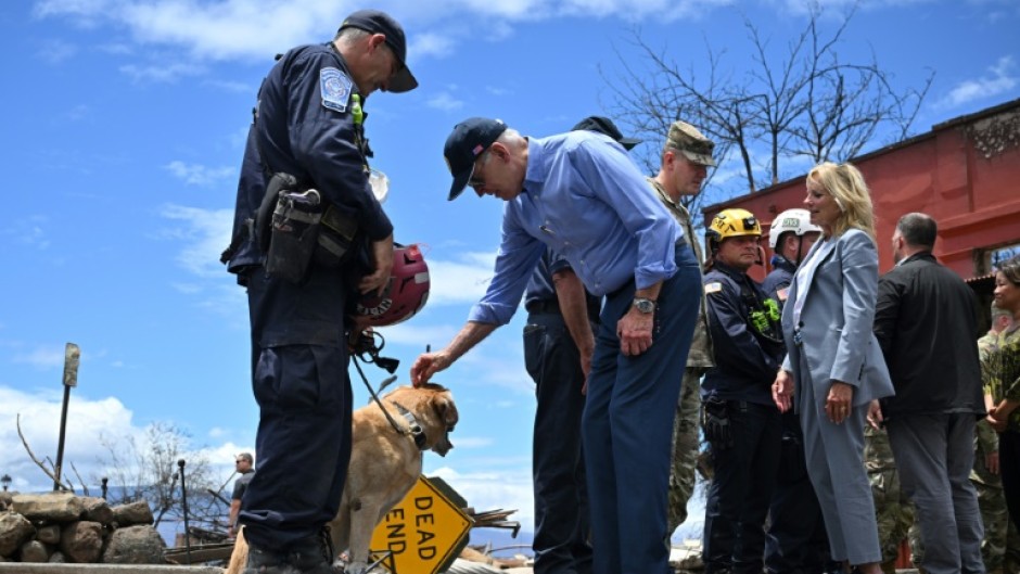 Biden met some of the search and rescue teams that are hunting for victims of the wildfire