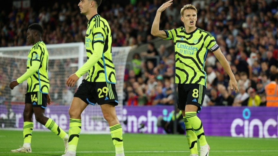 Arsenal's Martin Odegaard (R) celebrates scoring against Crystal Palace