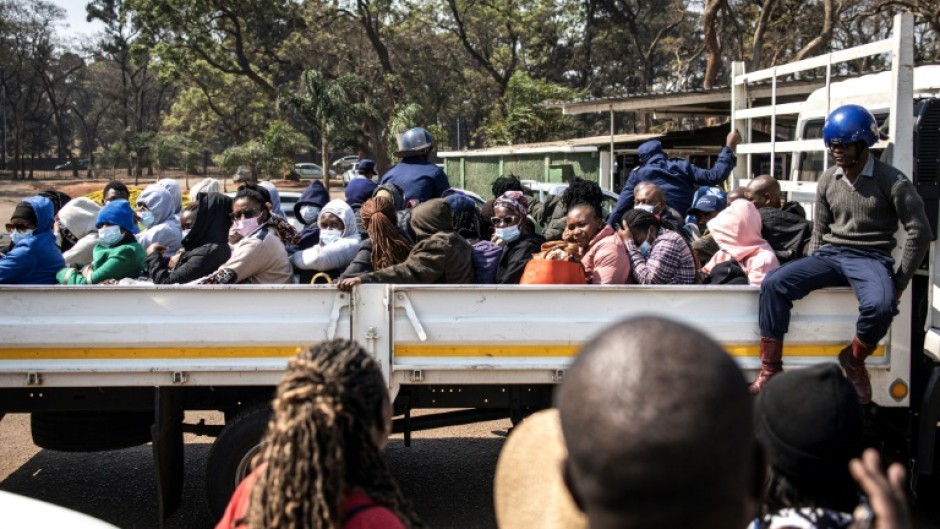 Three dozen local election observers were arrested, crammed into a truck and shipped off to a Harare court