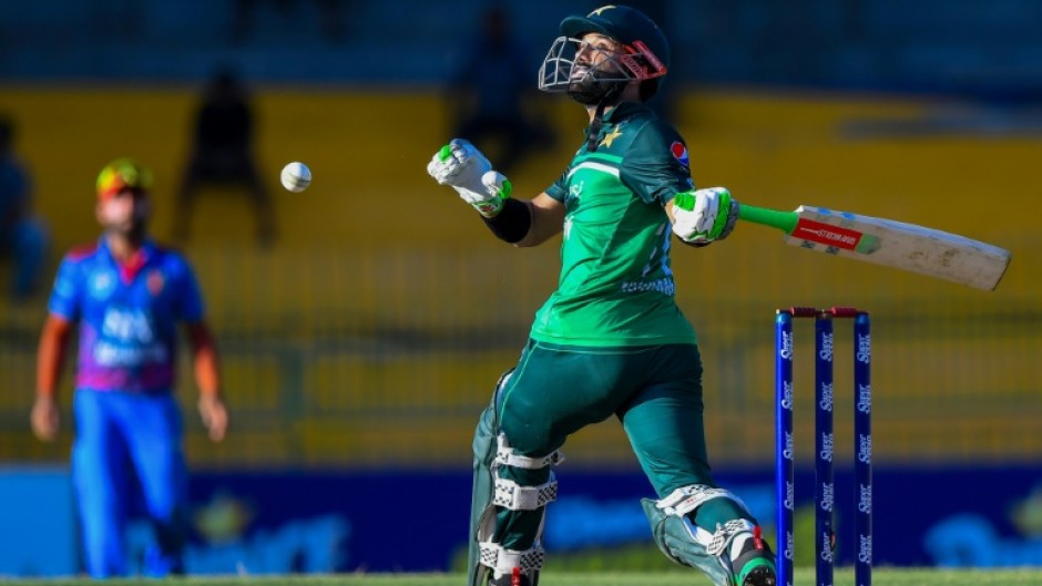 One hand or two? Pakistan's Mohammad Rizwan plays a shot