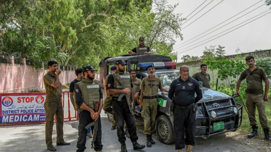 Security personnel stand guard outside the Attock prison, where former Pakistan prime minister Imran Khan is being held