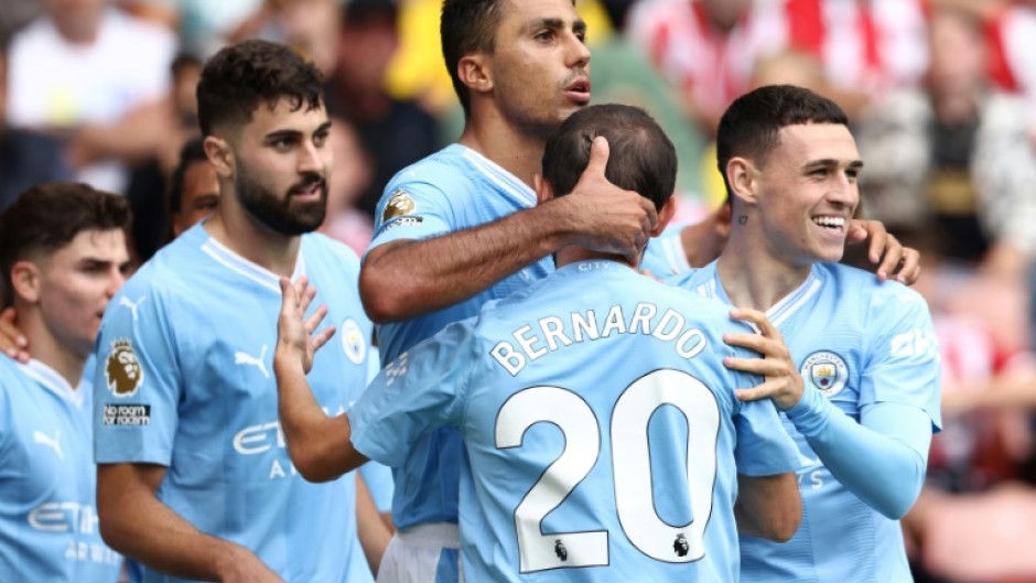 Manchester City midfielder Rodri (C) celebrates his winner at Sheffield United