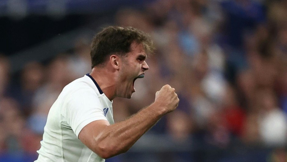 Try scorer Damian Penaud roars with delight after France beat the All Blacks