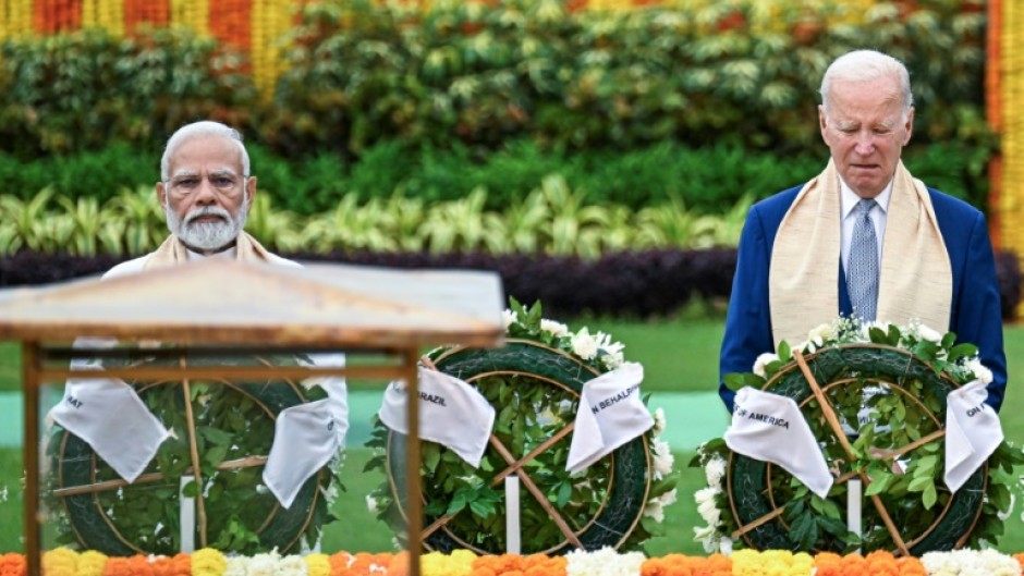 India's Prime Minister Narendra Modi and US President Joe Biden pay their respects at the Mahatma Gandhi memorial