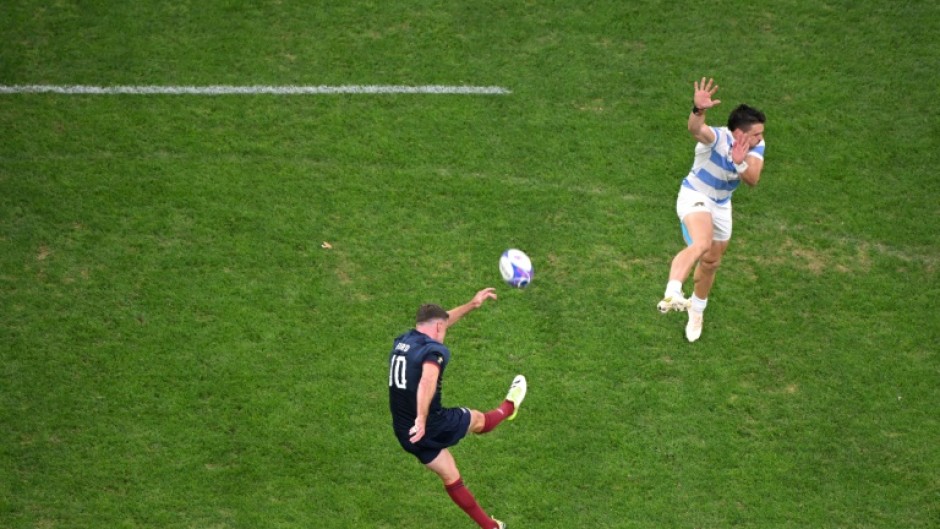 England's fly-half George Ford kicks a drop goal