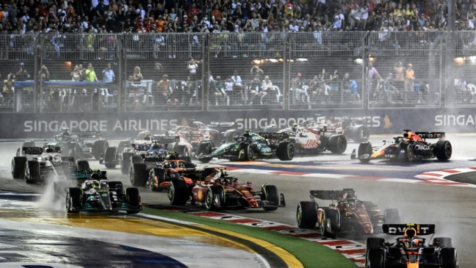 Red Bull's Sergio Perez leads in the rain at the start of the Singapore Grand Prix a year ago