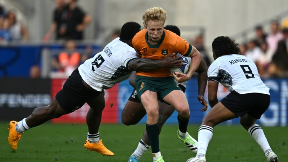 Australia fly-half Carter Gordon (centre) had a bruising encounter with Fiji