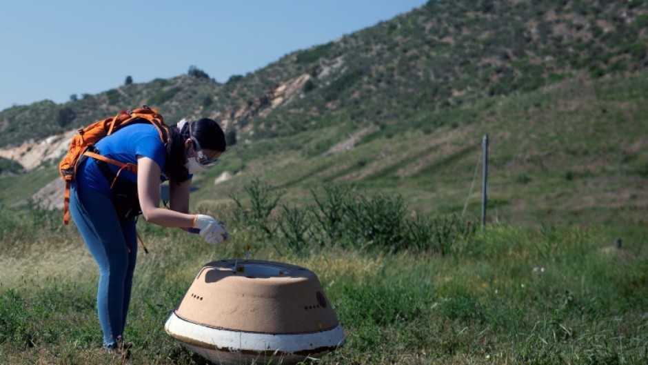 A replica of the Osiris-Rex capsule is seen on June 27, 2023 in Littleton, Colorado; the historic NASA mission is set to return a first asteroid sample to Earth