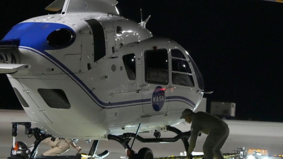 Crews prepare one of the helicopters that will participate in the Osiris-Rex asteroid sample return recovery mission in Dugway, Utah