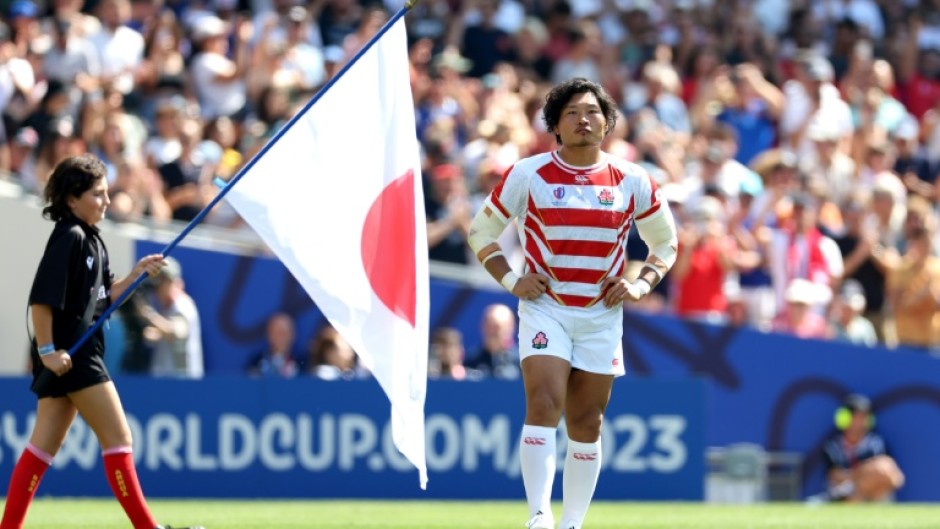 Japan's loosehead prop Keita Inagaki (R)