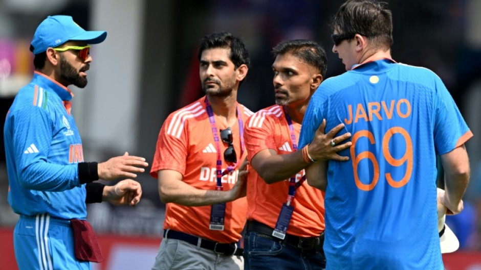 Security breach: Officials get between the pitch invader and India star Virat Kohli