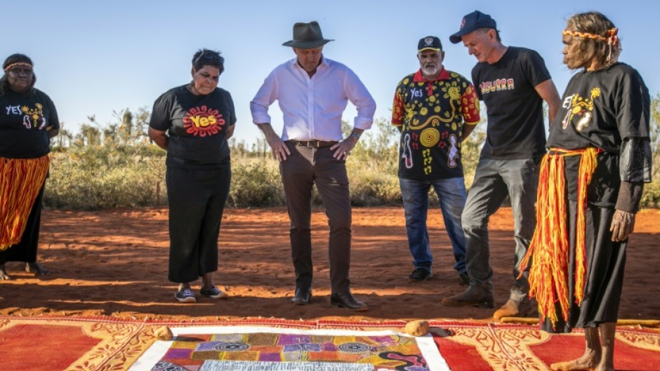 Australian Prime Minister Anthony Albanese (C) talks with Indigenous leaders from central Australia