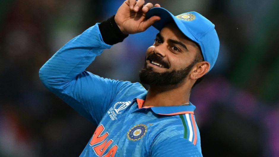 Fan favourite: India's Virat Kohli gestures to spectators during the win over Afghanistan 