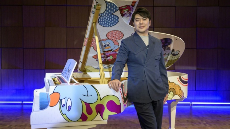 Pianist Lang Lang poses during the unveiling of the 'Steinway x Disney: Mickey Mouse Limited Edition' piano event at Steinway Hall New York in October 2023