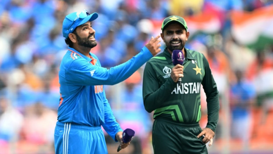 Centre of attention: India captain Rohit Sharma tosses the coin as Pakistan captain Babar Azam watches