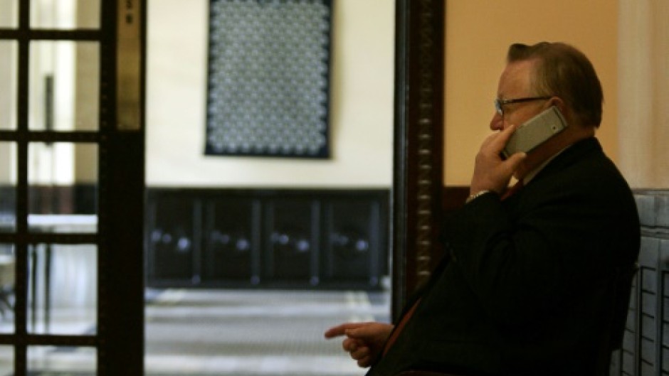 Veteran negotiator: Ahtisaari on the phone in a hotel in Dar es Salaam, Tanzania, in 2005