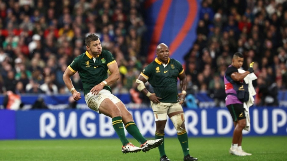 South Africa's fly-half Handre Pollard kicks the winning penalty for South Africa against England at the Stade de France