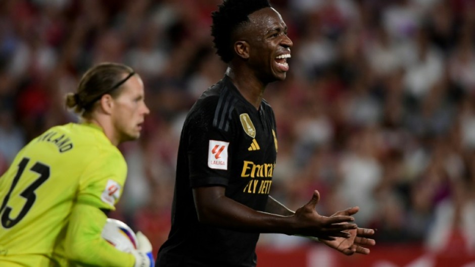 A Sevilla fan was expelled during the 1-1 draw with Real Madrid on Saturday and Los Blancos forward Vinicius Junior (R) says a child also made a racist gesture