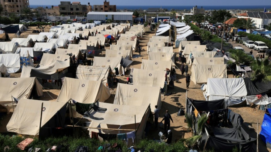 Tents for Palestinians seeking refuge are set up on the grounds of a UN Relief and Works Agency for Palestine Refugees centre in Khan Yunis in the southern Gaza Strip on October 19, 2023