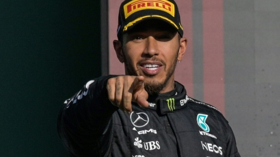 Mercedes' British driver Lewis Hamilton celebrates on the podium after placing second after the Formula One Mexico Grand Prix at the Hermanos Rodriguez racetrack in Mexico City on October 29, 2023.