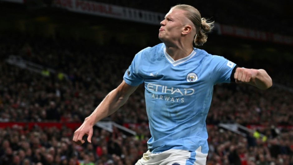 Erling Haaland celebrates his goal from the penalty spot against Manchester United