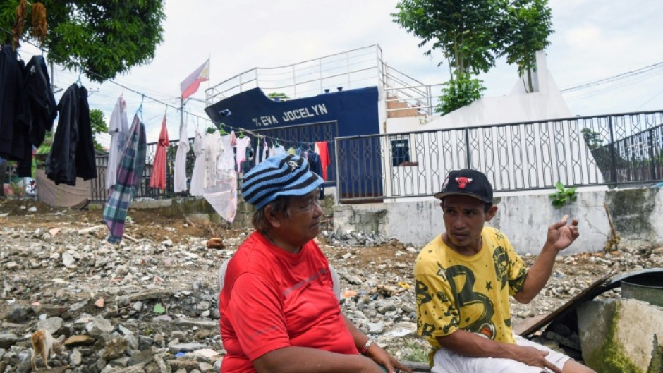 Rosie Boaquena, 63, moved to a new concrete house 13 kilometres from downtown Tacloban, but two of her sons chose to stay in a one-room shack by the sea to be closer to their jobs