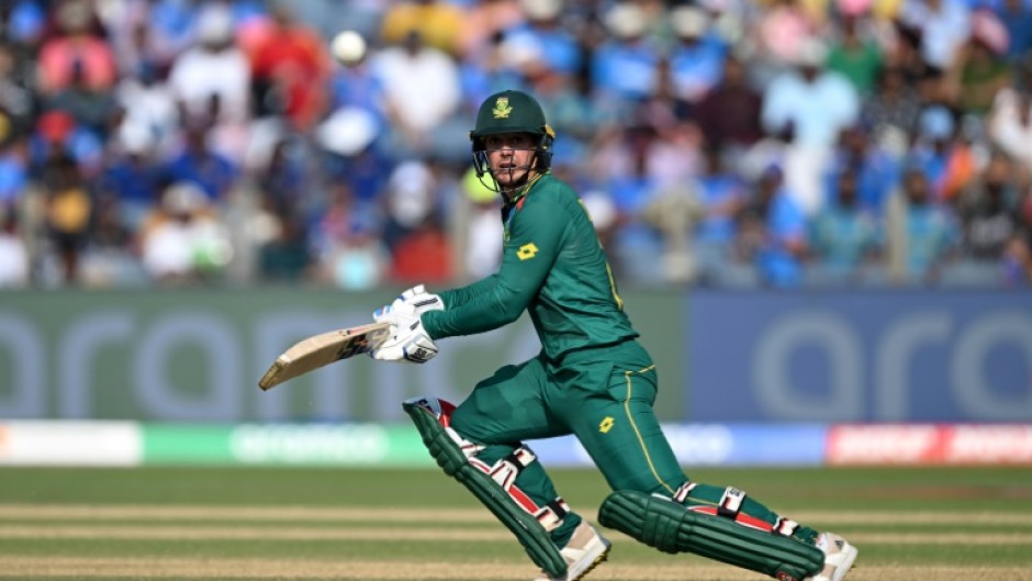 Century makers: South Africa's Quinton de Kock (left) celebrates with teammate Rassie van der Dussen 