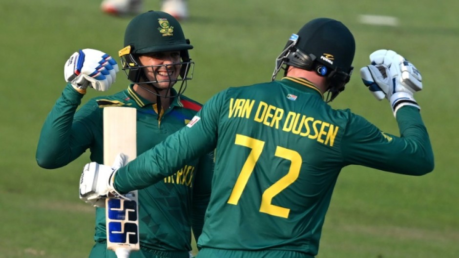 Century makers: South Africa's Quinton de Kock (left) celebrates with teammate Rassie van der Dussen 