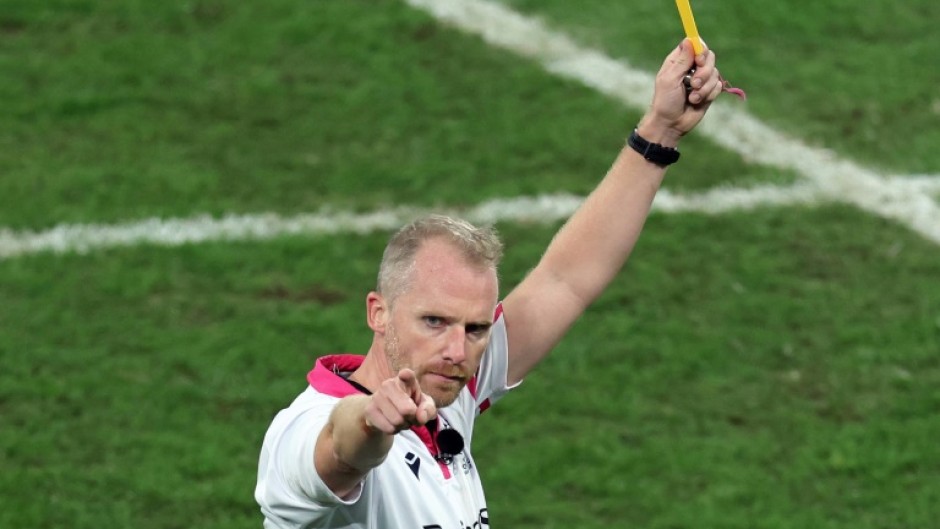 The final card: Wayne Barnes shows a yellow card to South Africa's Cheslin Kolbe in the closing minutes of the World Cup final