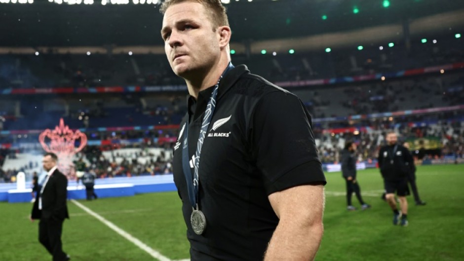 New Zealand captain Sam Cane walks on the field with his silver medal after South Africa won the Rugby World Cup final in Paris