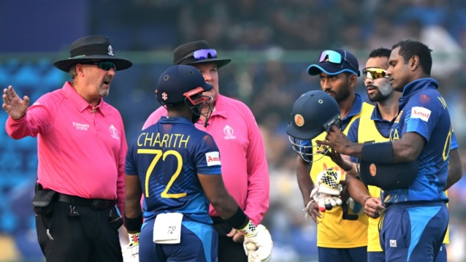 Out: Sri Lanka's Angelo Mathews listens to the umpires after he was timed out