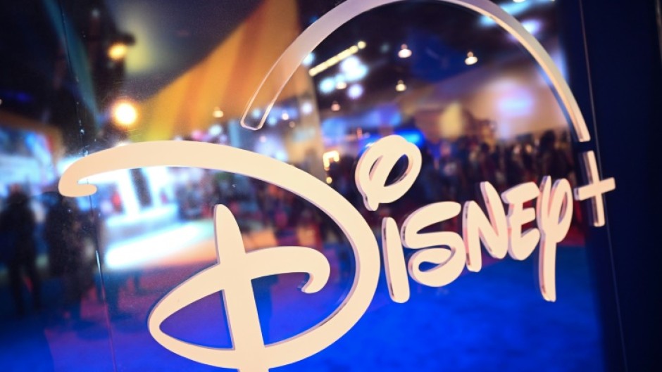 Fans are reflected in Disney+ logo during the Walt Disney D23 Expo in Anaheim, California in September 2022