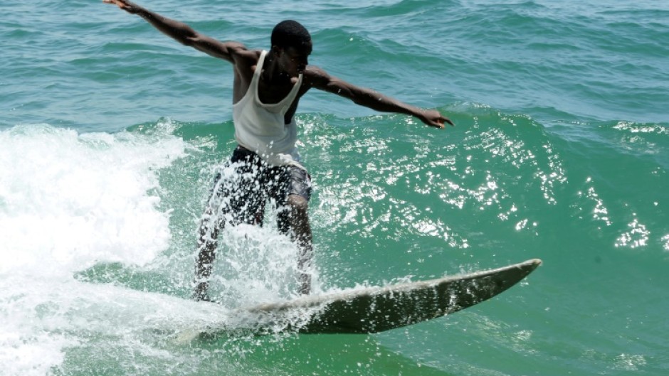 The waves and white sandy beaches at Liberia's Robertsport are attracting interest from European surfers  