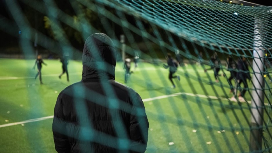 Fear: a parent oversees children training at Rinkeby United football club near Stockholm