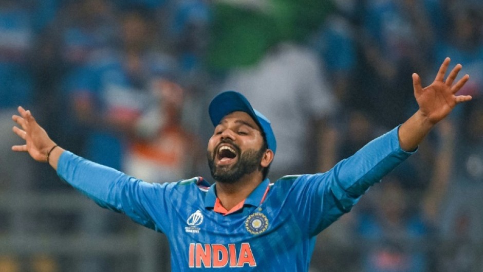 Captain courageous: India skipper Rohit Sharma celebrates his side's World Cup semi-final win over New Zealand