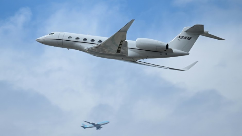 A Gulfstream G650 private jet takes off from Los Angeles International Airport (LAX) as seen from El Segundo, California; Oxfam is calling for a progressive climate policy that taxes the wealthiest carbon emitters at a higher rate